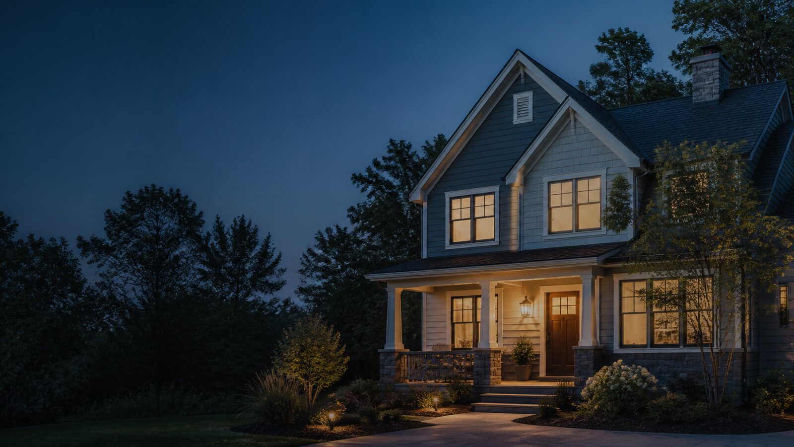 A well-cared-for home illuminated at dusk